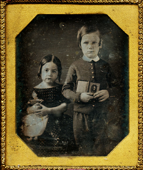 Brother and Sister Displaying a Daguerreotype of Their Dead Father