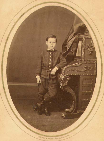 Photo Detail - Osborne & Malthaner - Portrait of a Boy at His Piano-like Desk