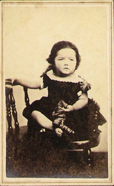 W. G. Smith - Frowning Little Girl Who Has Taken off Her Stockings