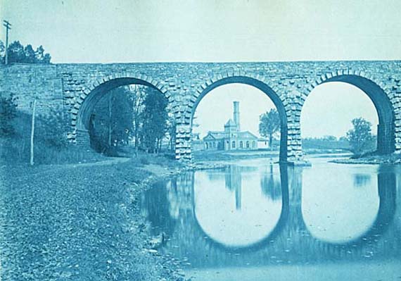 Stone Arches of a Bridge Frame and Old Factory