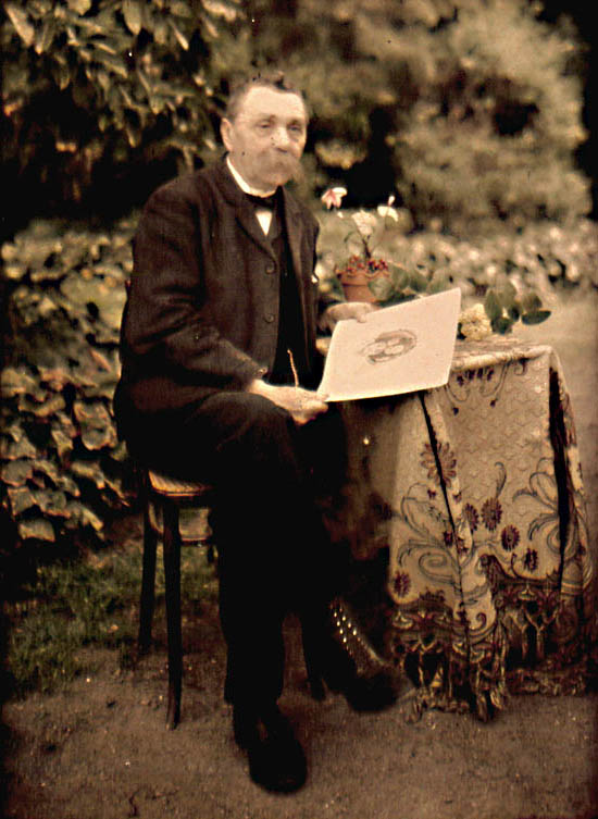 Painter in Garden with His Work