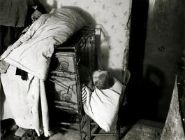 Click for details about de Sazo - Child Sleeping in a Fold-up Bed, WWII de Sazo - Child Sleeping in a Fold-up Bed, WWII