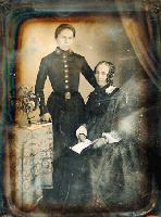 Click for details about Anonymous (French) - Boy in Military Uniform with Mother with Stereo Viewer and Flowers on Table Anonymous (French) - Boy in Military Uniform with Mother with Stereo Viewer and Flowers on Table