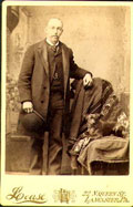 Lease - Man with a Bowler Hat and Dog