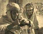 Algerian Woman Stringing Beads