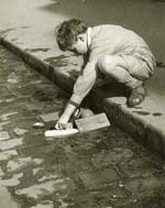 Boy Playing by a Street Curb, Paris