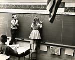 Rohn Engh - Children at Blackboard (American Flag in Foreground)