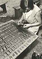 Woman Putting Labels on Bottles of Champagne