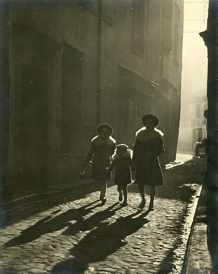 Fernand Triol - Mother and Children Walking Down Cobblestone Street