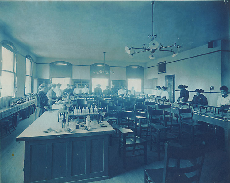 Anonymous - Girls at Work in What Looks Like a Combination of Home EC and Chemistry Class Anonymous - Girls at Work in What Looks Like a Combination of Home EC and Chemistry Class