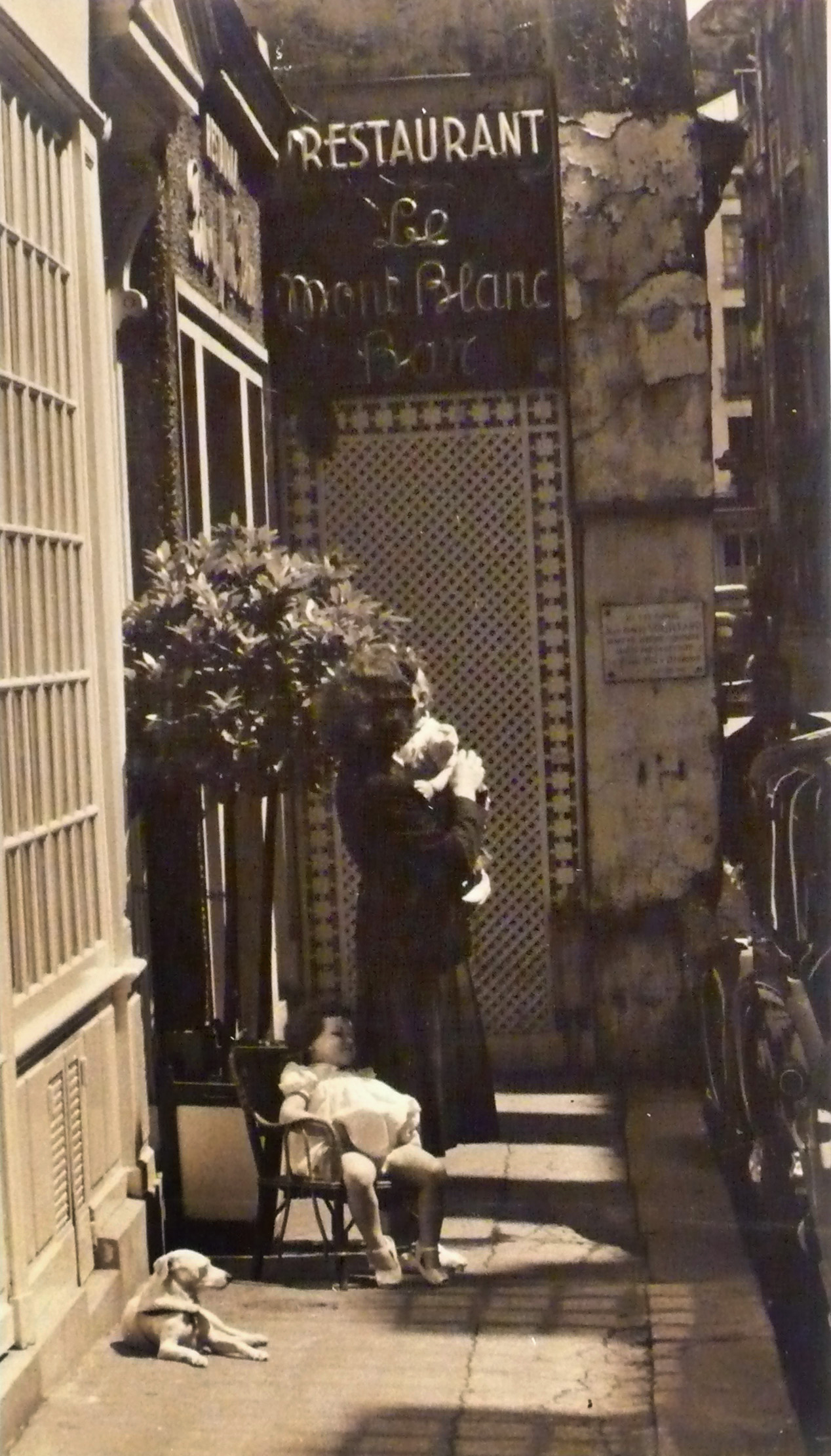 Kenneth Heilbron - Mother, Children and Dog outside Le Mont Blanc Bar Kenneth Heilbron - Mother, Children and Dog outside Le Mont Blanc Bar