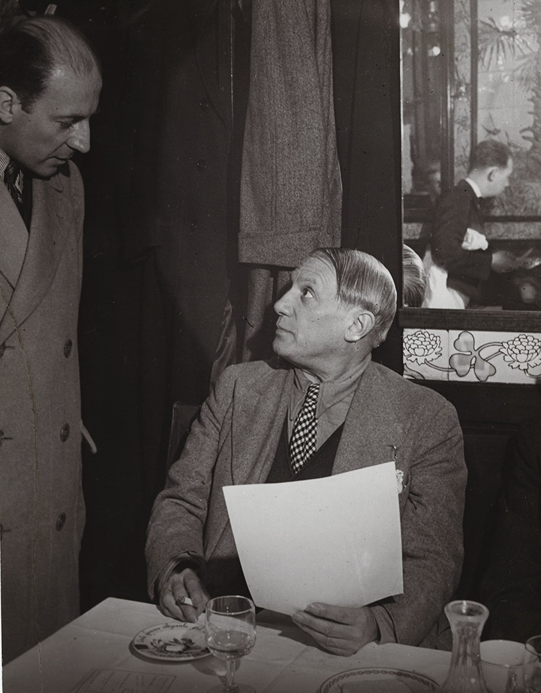 Brassai (Gyula Halasz) - Picasso at the Brasserie Lipp with Pierre Matisse