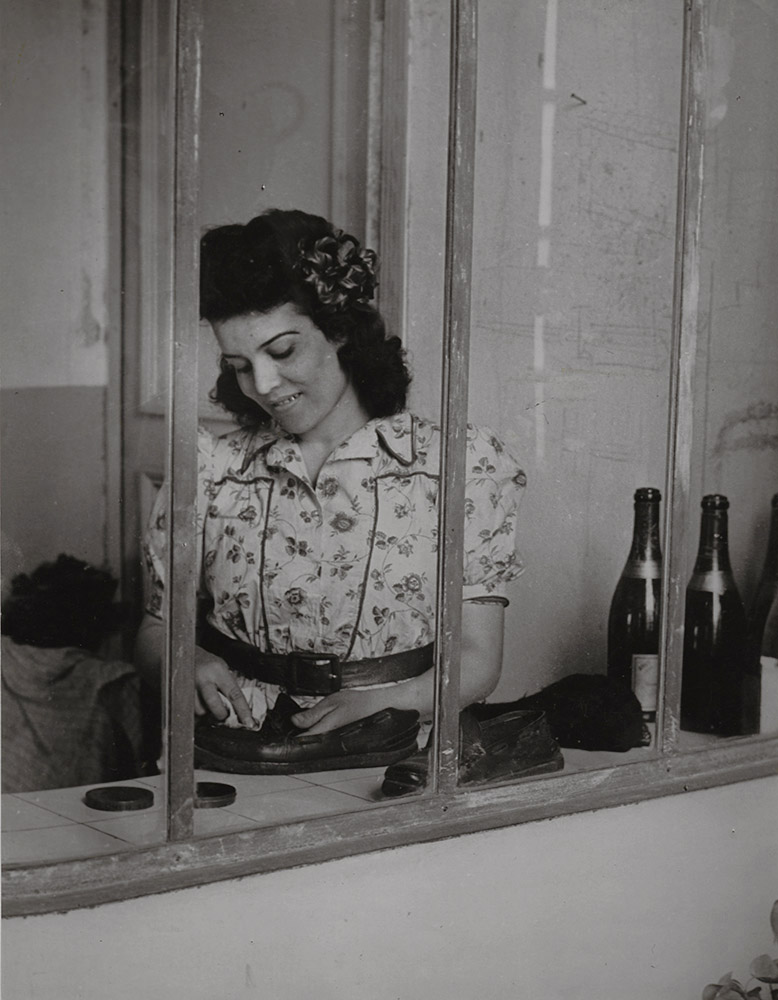 Brassai (Gyula Halasz) - Picasso's Maid, Inès, with Wine Bottles and Shoes