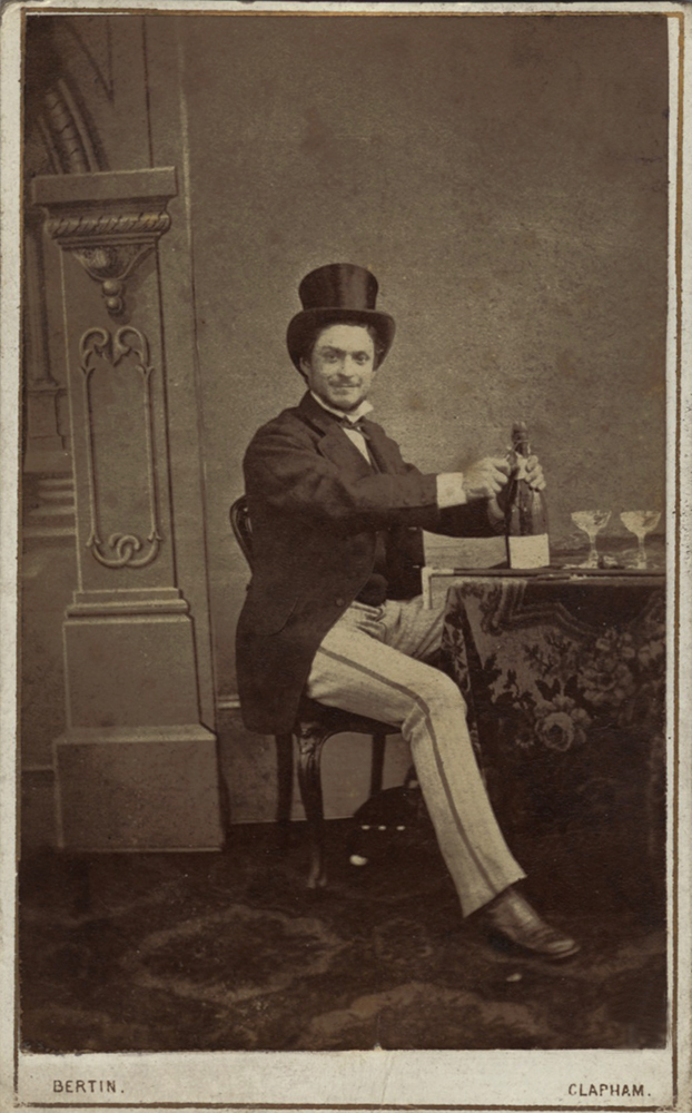 Louis - Man with Top Hat Opening a Bottle of Champagne with Glasses and Cane