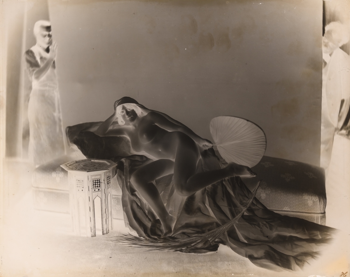 H.? - Female Nude with Two Male Assistants Holding Back Drop