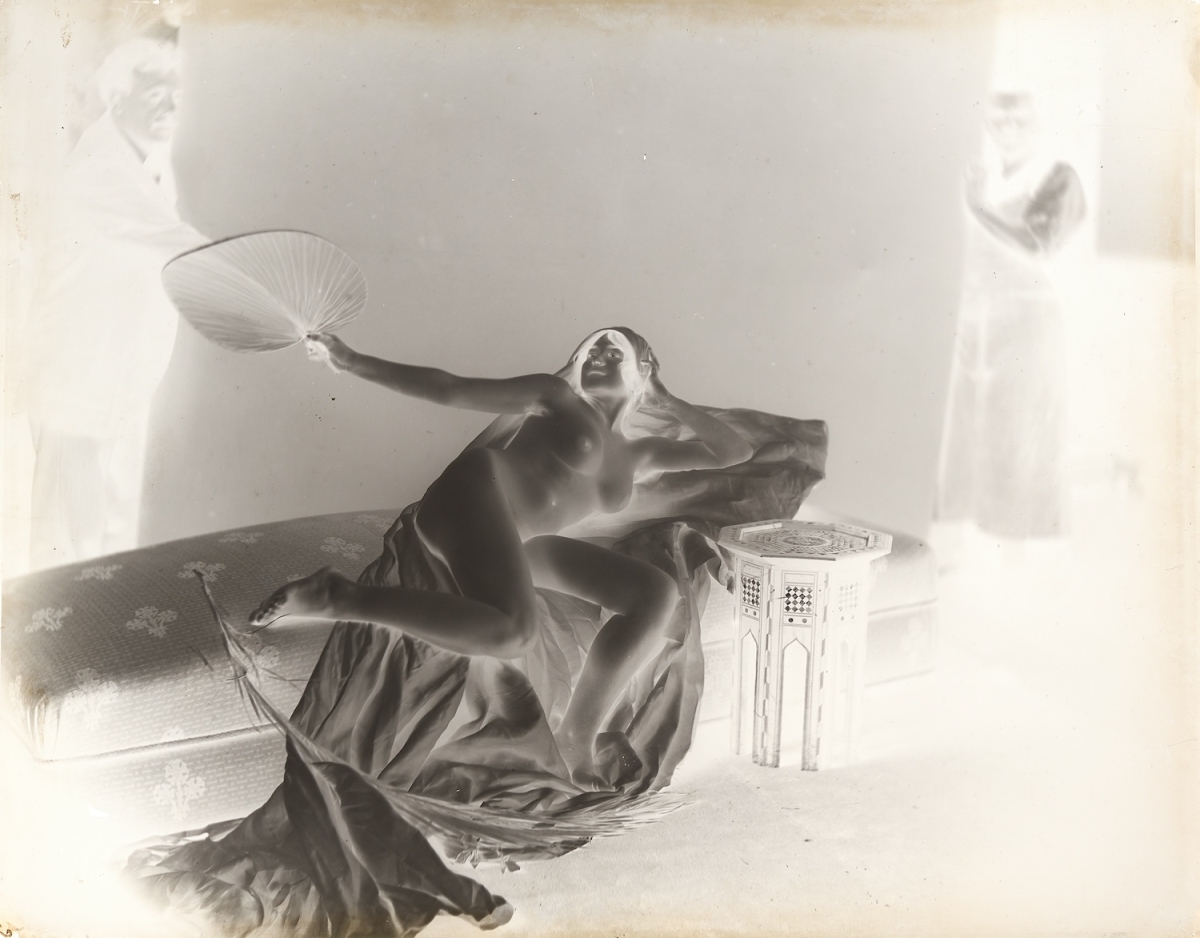 H.? - Female Nude with Two Male Assistants Holding Back Drop