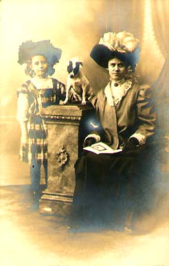 Anonymous - Woman and Girl with Fancy Hats and a Dog on a Column