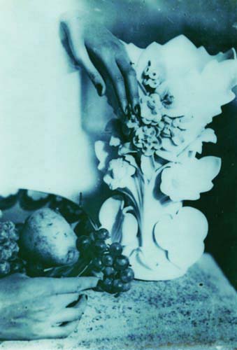 Jacques-Henri Lartigue - Still Life with Disembodied Hands, Fruit, and Vase Jacques-Henri Lartigue - Still Life with Disembodied Hands, Fruit, and Vase