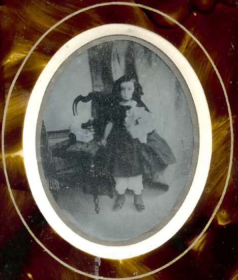 Anonymous - Girl with Doll and Toy on Chair Anonymous - Girl with Doll and Toy on Chair