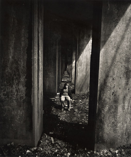 Arthur Tress - A Boy Sits under an Abandoned Railroad Track, Staten Island, NY