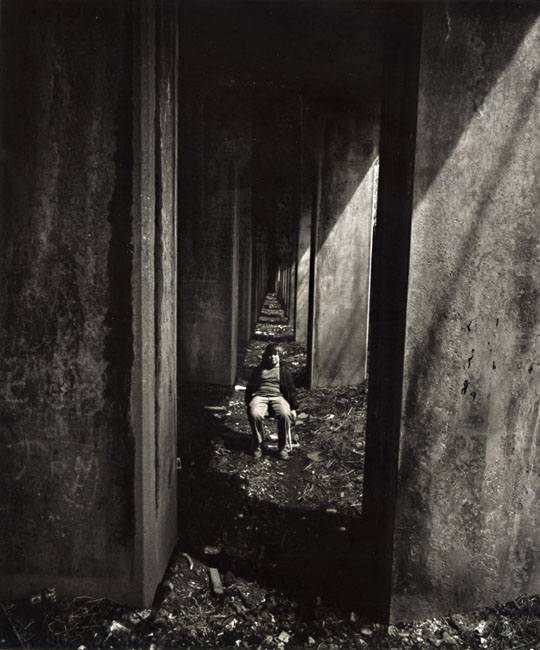 Photo Detail - Arthur Tress - A Boy Sits under an Abandoned Railroad Track, Staten Island, NY