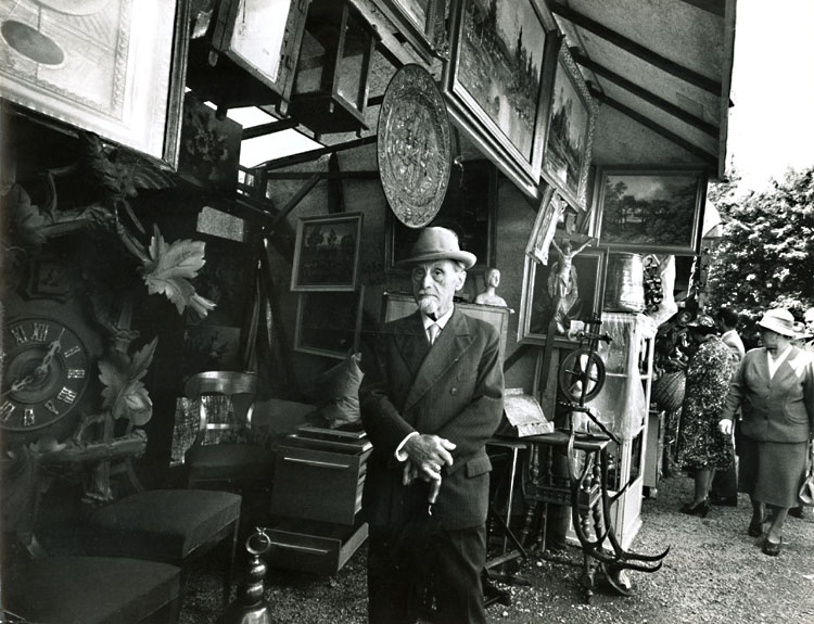 Marvin B. Winter - Man Standing in Antique Shop, Paris